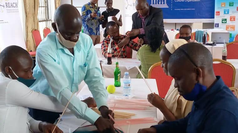 Teachers work on a hands-on activity during a STEM Mentorship Program facilitated by the Uganda National Commission for UNESCO with support from IEEE Foundation donors. 