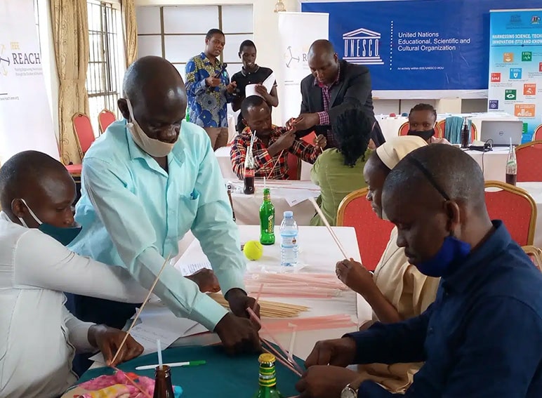 Teachers work on a hands-on activity during a STEM Mentorship Program facilitated by the Uganda National Commission for UNESCO with support from IEEE Foundation donors.