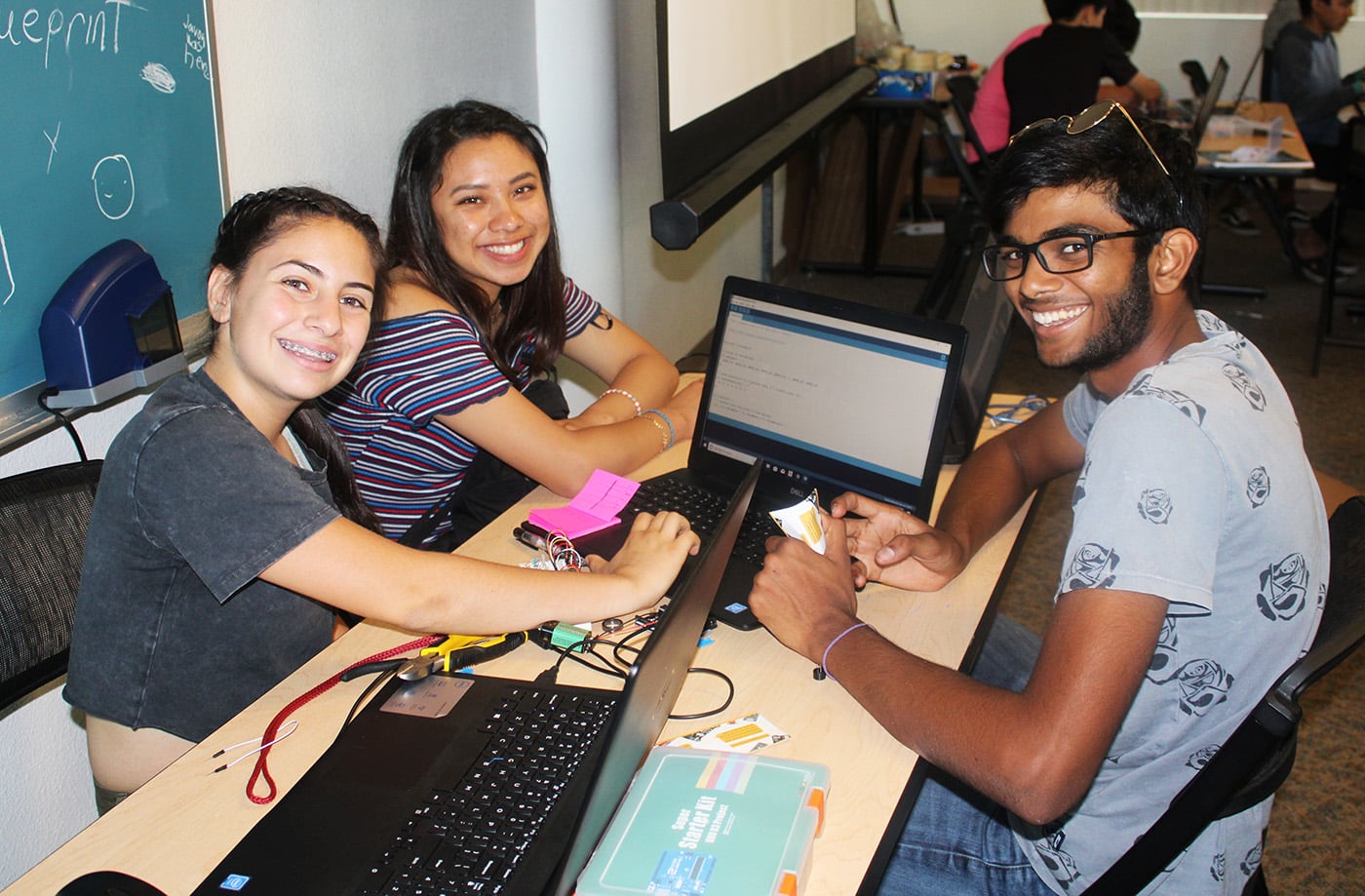 TESI Donate UCR 2019 3 Smiling Teens With Computers